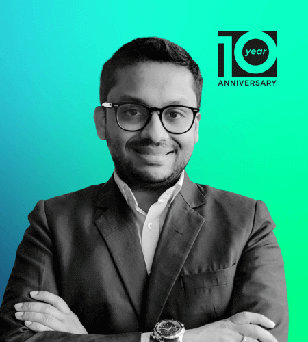 A black and white profile photo of Dr Atif Syed against a green gradient background