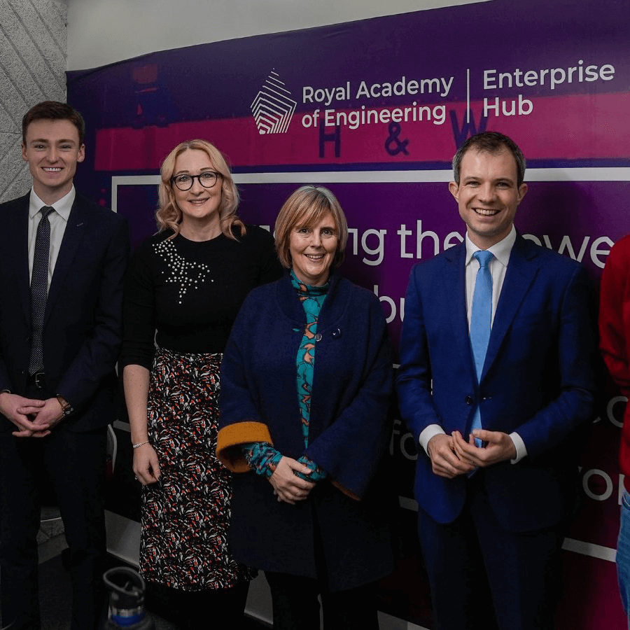 Gillian Gregg and Daniel Lowe standing with two guests at an event